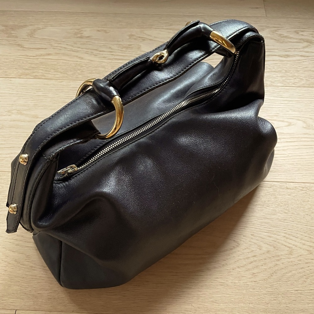 Gucci leather bag with gold bit.